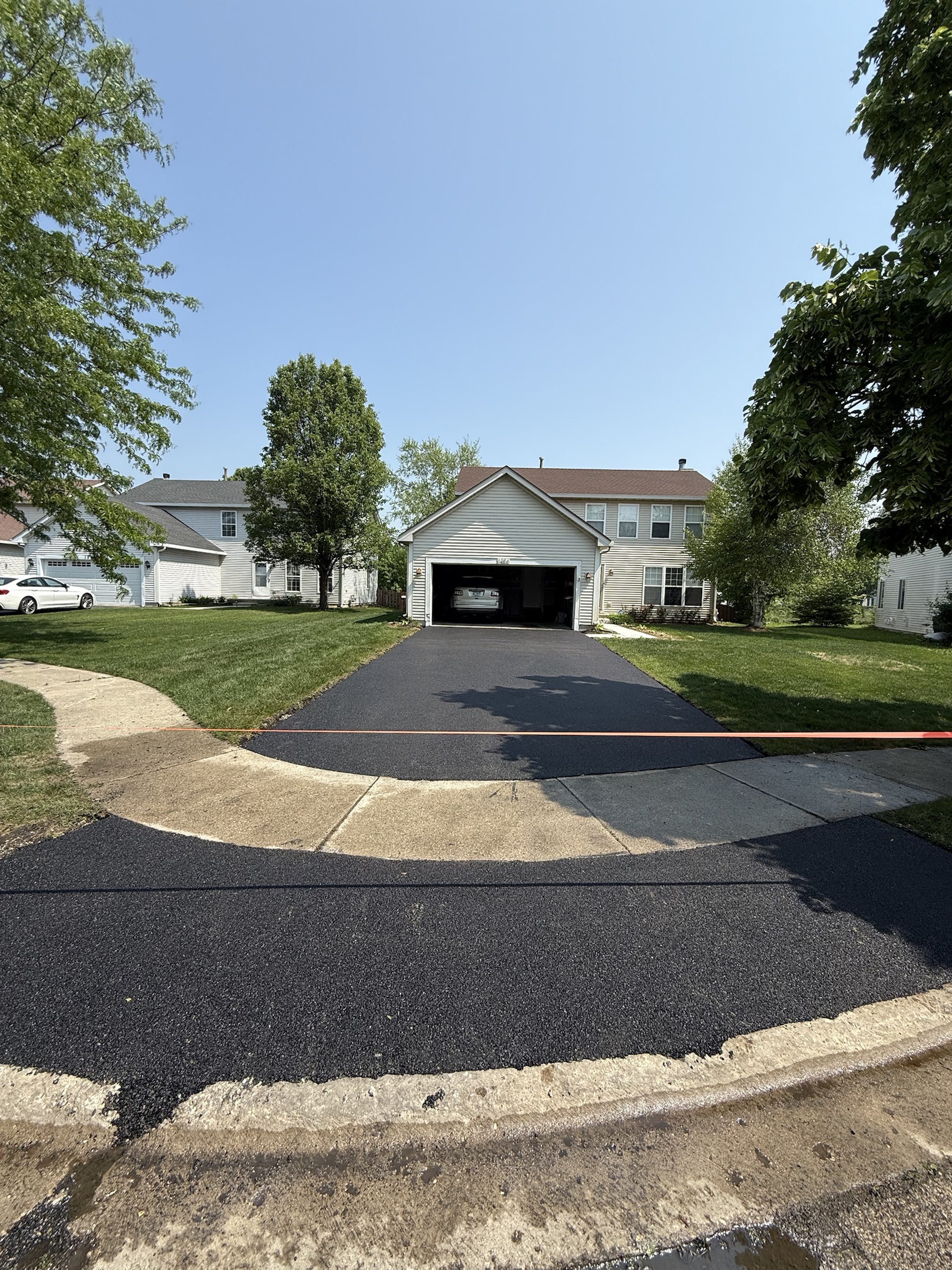 Asphalt driveway refresh by PFS Concrete & Asphalt