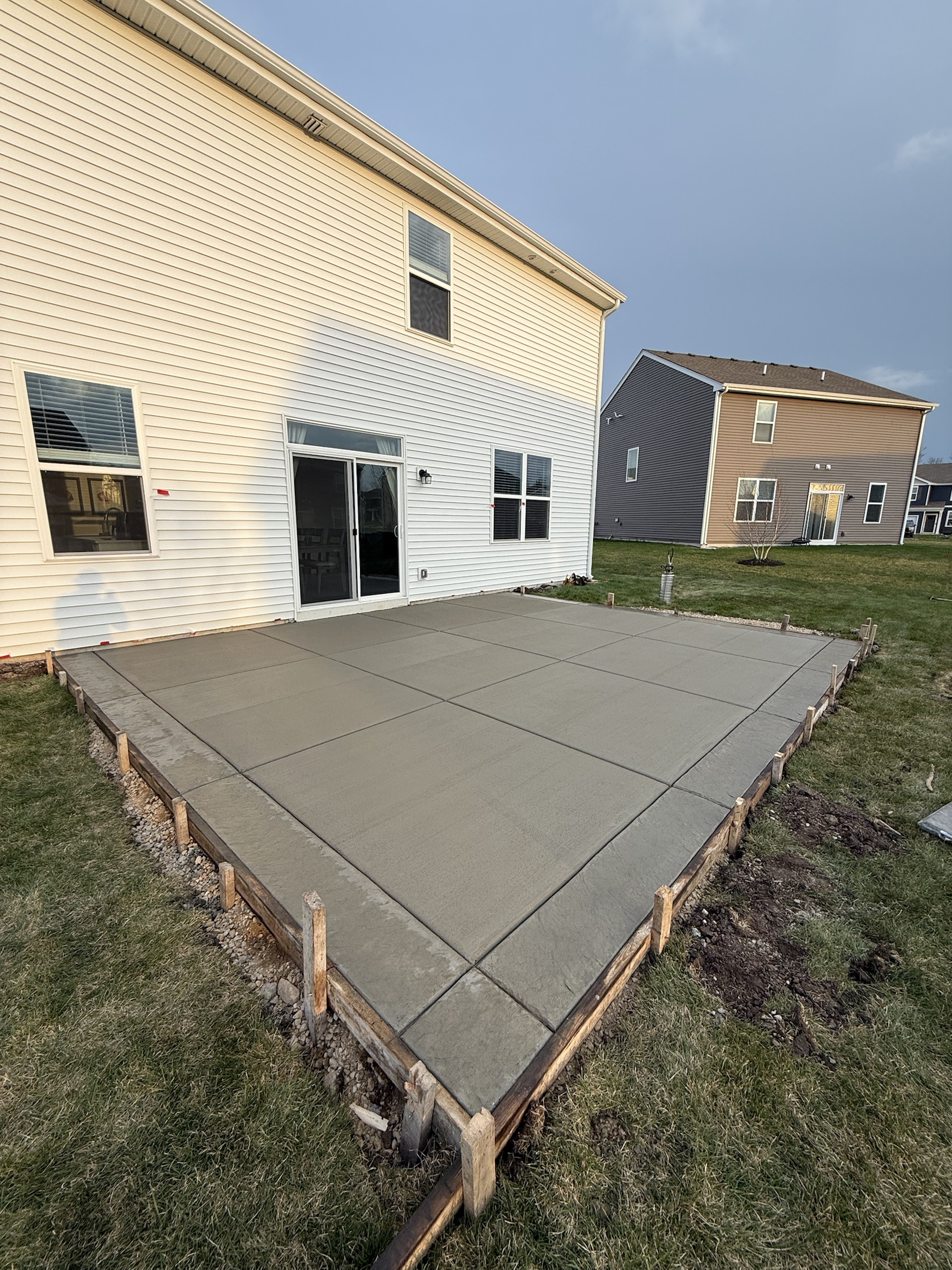 Backyard concrete patio formed and poured by PFS Concrete & Asphalt
