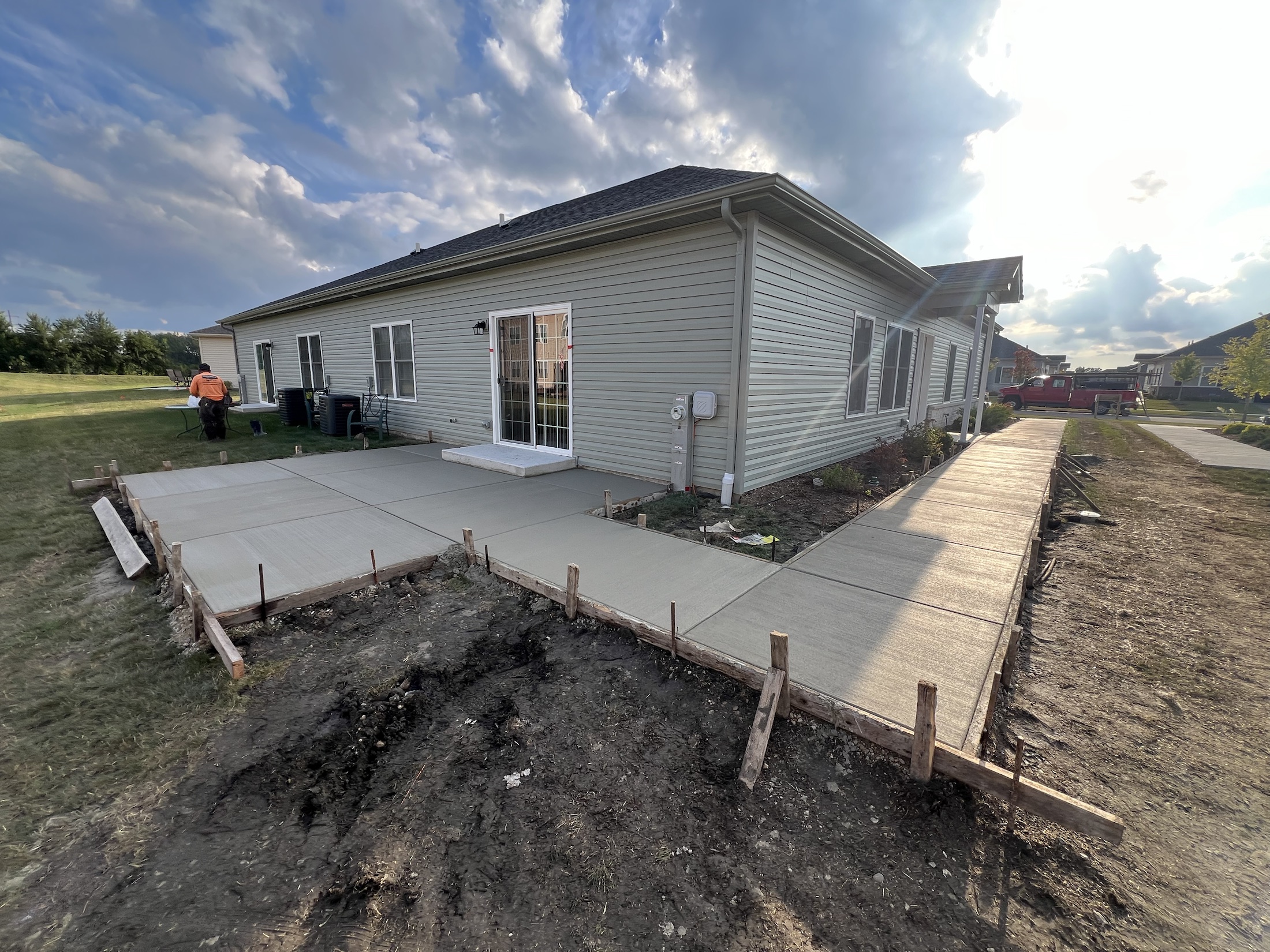 Backyard patio and walkway addition by PFS Concrete & Asphalt