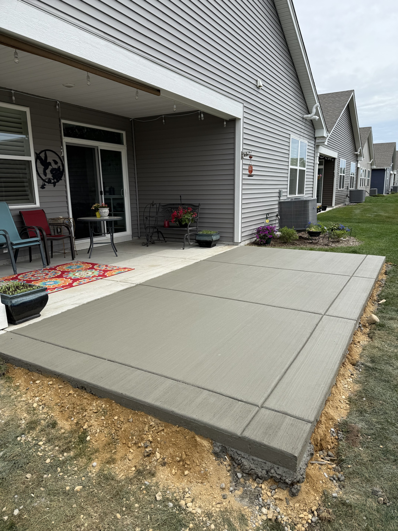 Covered patio concrete slab by PFS Concrete & Asphalt