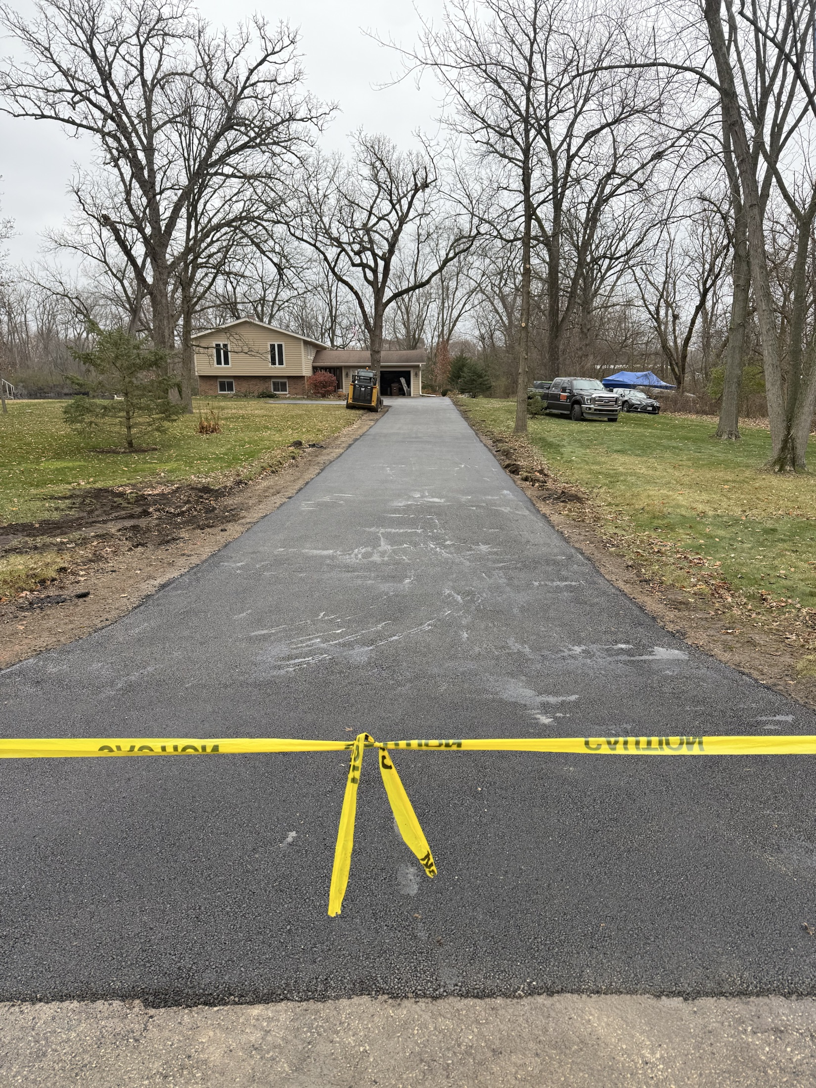 Fresh asphalt driveway by PFS Concrete & Asphalt