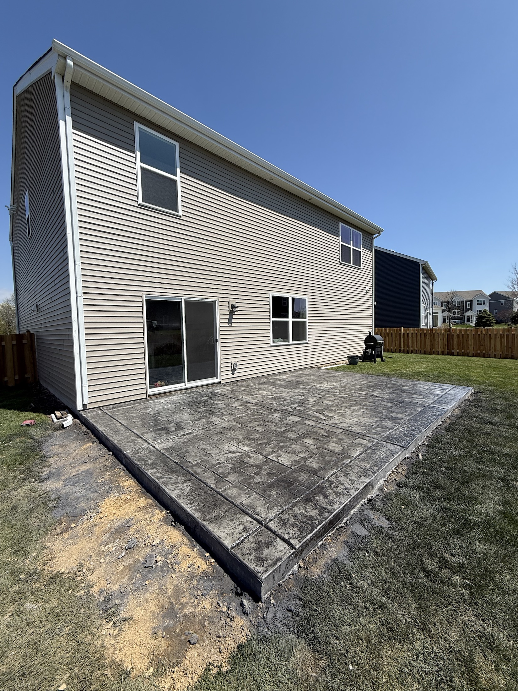 Stamped backyard patio finish by PFS Concrete & Asphalt